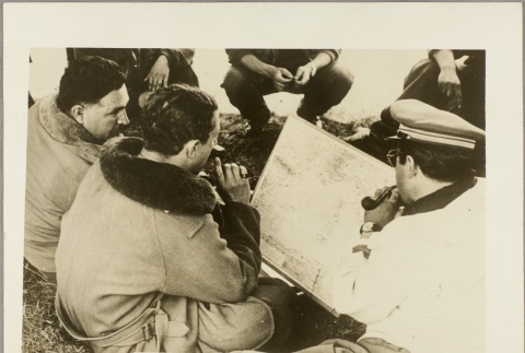 Italian pilots looking at a map (ddr-njpa-13-784)