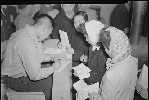 Japanese Americans voting (ddr-densho-37-169)