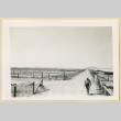 Man walking down a dirt road (ddr-densho-37-1625)
