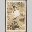 Woman standing in garden (ddr-densho-316-260)