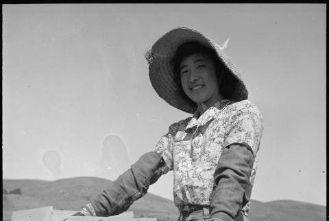 Nisei girl working in field (ddr-densho-151-313)