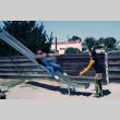 Playing on a slide (ddr-densho-336-165)