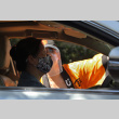 Woman directing a women driving a car (ddr-densho-512-38)