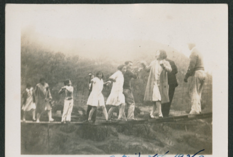 group on suspension bridge (ddr-densho-378-464)