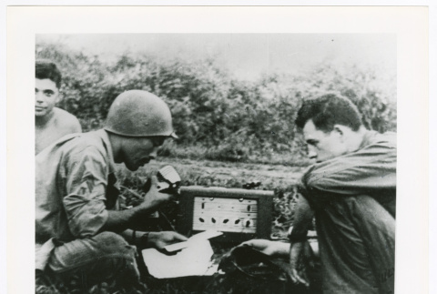 Three men with radio (ddr-densho-1007-413)