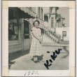 Woman standing near shop (ddr-densho-321-111)