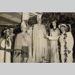 An Aloha Week king and queen in traditional dress greeting a Lurline captain (ddr-njpa-2-512)