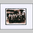 Group of 13 men and a baby outside a shrine (ddr-densho-423-455)