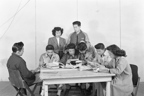 High school students reading and looking at photos (ddr-fom-1-560)