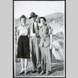Photograph of three people standing at Zabriskie Point in Death Valley (ddr-csujad-47-123)