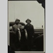Men with fish and fishing pole (ddr-densho-201-335)