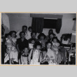 Group photo of seven adults and seven children (ddr-densho-522-341)