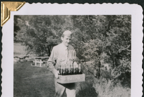 Man carrying box of bottles (ddr-densho-434-245)