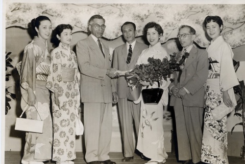 Members of a Japanese dance troupe posing with Honolulu Rotarians (ddr-njpa-2-519)