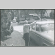 Chester Sakura washing car (ddr-densho-523-611)