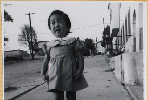 Susan Shiomi standing on sidewalk (ddr-densho-522-275)