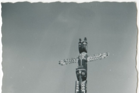 Man in front of totem pole (ddr-densho-326-5)