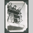 3 men peering over railing (ddr-densho-540-101)