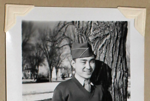 Smiling man in military uniform (ddr-densho-404-381)