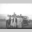 Group of Japanese Americans in front of a car (ddr-densho-153-341)