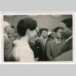 Woman in kimono in a crowd (ddr-densho-501-21)