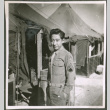Soldier in front of tents (ddr-densho-201-485)