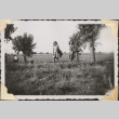 Two girls standing in a field (ddr-densho-466-633)