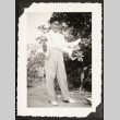 Yosh Kikawa holding two pigeons (ddr-densho-542-367)