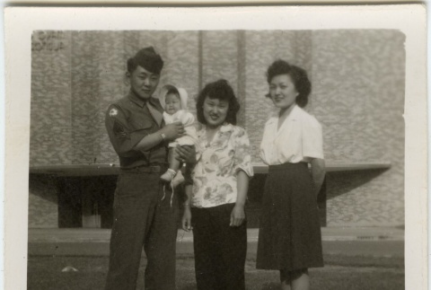 Japanese American soldier with two women and baby (ddr-densho-201-178)