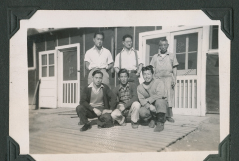 Six men outside barrack (ddr-densho-471-71)