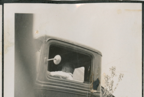 Photo of a child in a truck (ddr-densho-483-880)