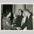 Woman shaking hands at a reception line.  Likely a reception or event related to redress and creation of the CWRIC (ddr-densho-393-10)