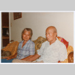 Two people sitting on couch (ddr-densho-501-59)