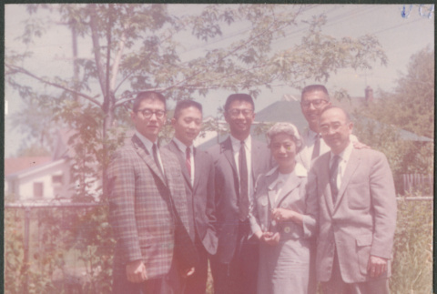 Sakura family in garden (ddr-densho-523-313)