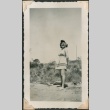 Woman stands in sundress on beach (ddr-densho-321-167)