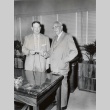 Sears executive giving a check to a University of Hawaii dean (ddr-njpa-2-1010)