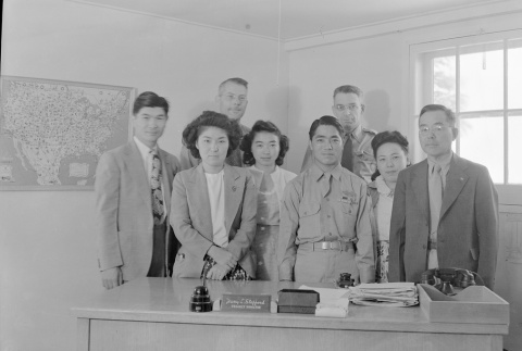 A soldier and others gathered in Harry L. Stafford's office (ddr-fom-1-367)