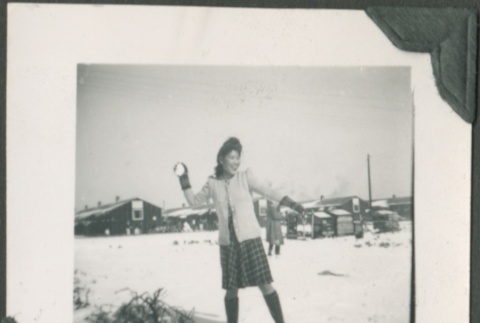 Woman throwing a snowball (ddr-densho-328-20)