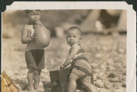 Two children playing on beach (ddr-densho-483-510)