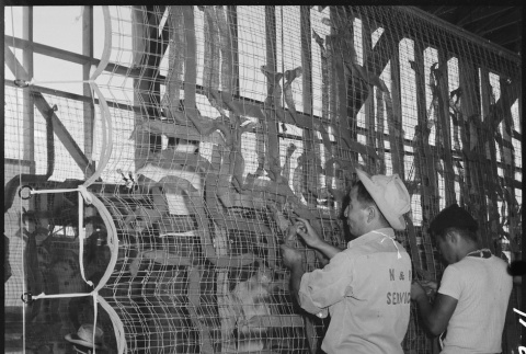 Japanese Americans making camouflage nets (ddr-densho-151-413)