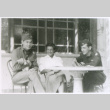 3 at table with pet (ddr-densho-1007-753)