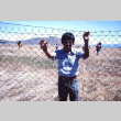 A man behind barbed wire at Tule Lake (ddr-densho-294-56)