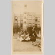 Man standing by table with altar (ddr-densho-426-1958)
