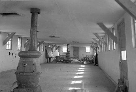 Interior of a barracks being renovated or demolished (ddr-fom-1-662)