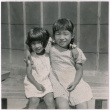 Two Japanese American girls pose for photo (ddr-densho-362-3)