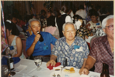 Three men sitting at a table (ddr-densho-466-474)