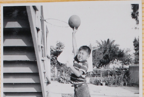 William Shiomi with basketball (ddr-densho-522-257)