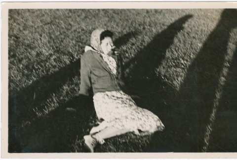 A woman sitting in a field (ddr-densho-338-102)