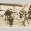 Victor Lytton seated on a ship's deck with another man (ddr-njpa-1-1209)