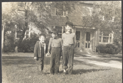 David, Chester Jr. and Gerald Sakura standing on lawn (ddr-densho-523-170)